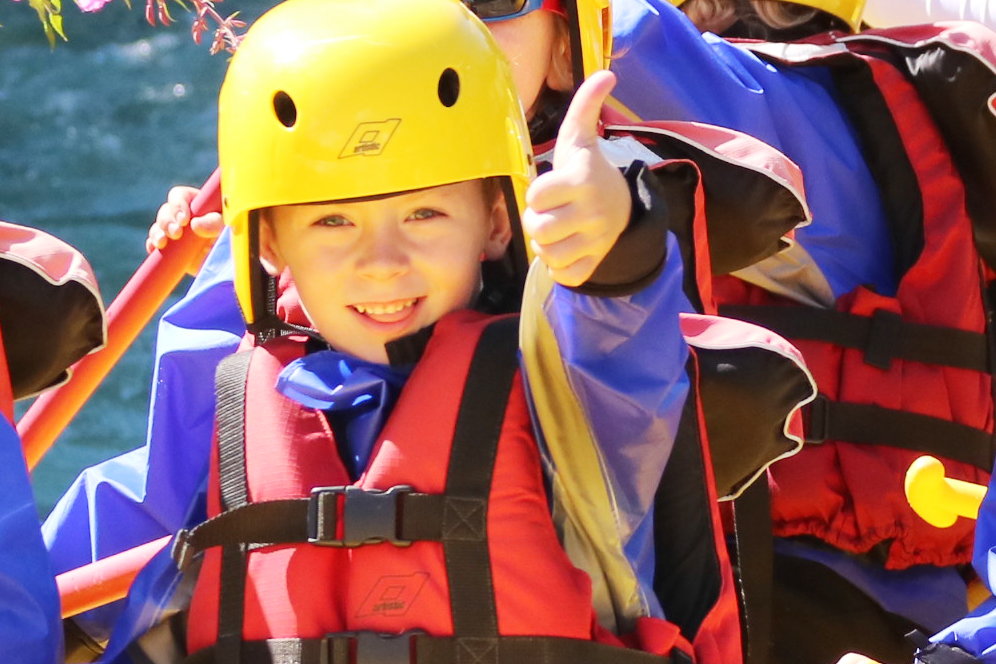 children go whitewater rafting in serre chevalier on guisane river