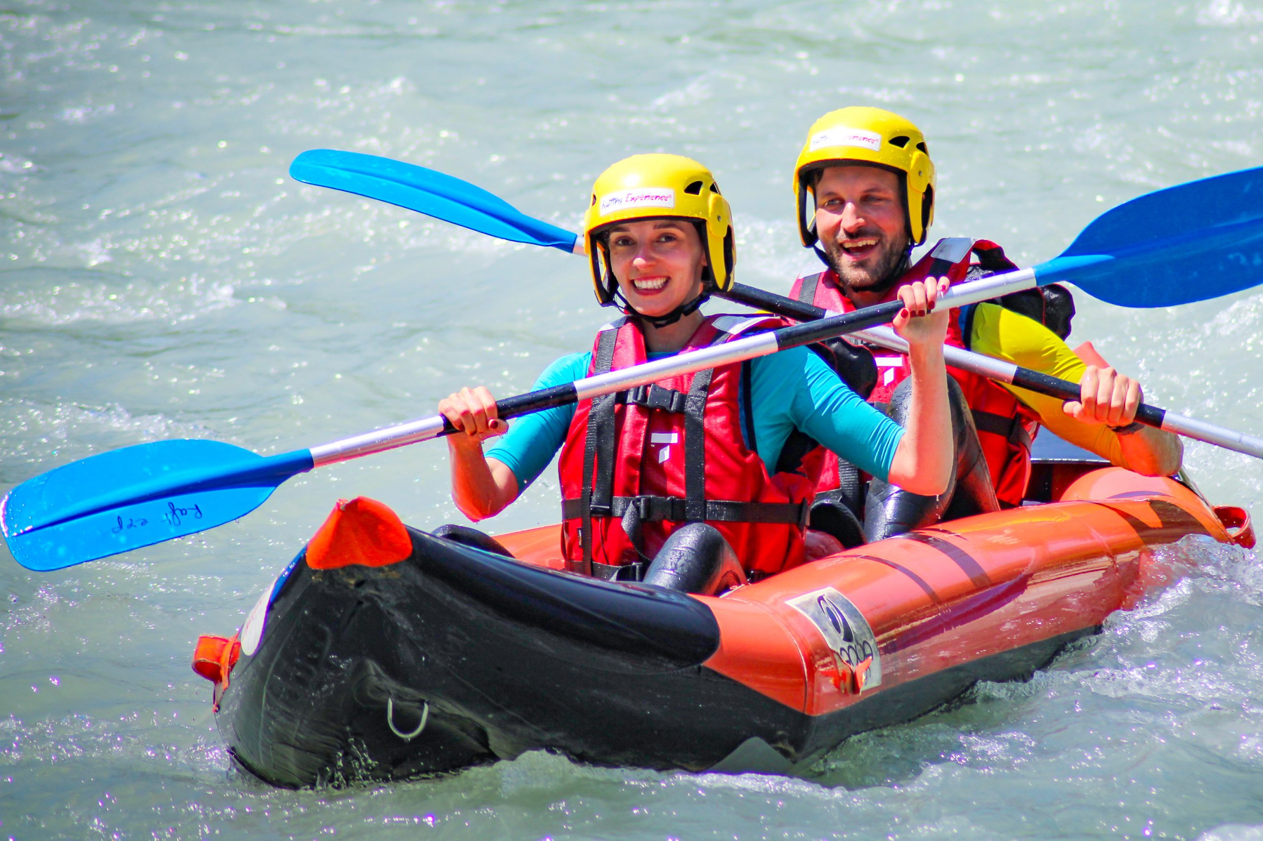 In cano-rafting, two people are descending the river